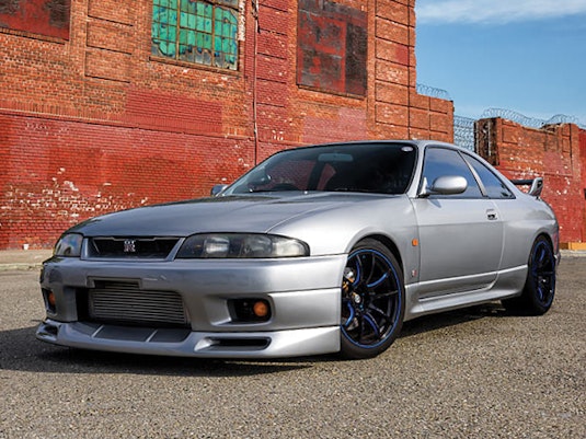 A silver Nissan Skyline GTR.