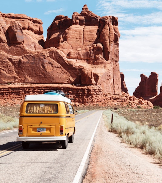 Camper van driving through canyon